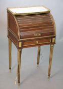 A child's 19th century French gilt metal mounted mahogany cylinder front bureau, with white marble