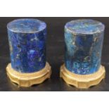 A pair of late 18th century ormolu mounted lapis lazuli socles, with laurel leaf and fluted