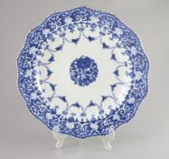 A Chinese porcelain charger, Qing dynasty, mid 18th century, painted in underglaze blue with a