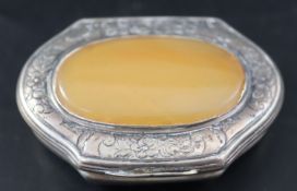 A 19th century Continental engraved white metal snuff box, with inset agate hinged cover, 57mm,