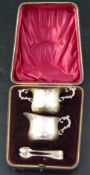 A late Victorian cased silver three piece cream and sugar set, George Unite, Birmingham, 1900, 84