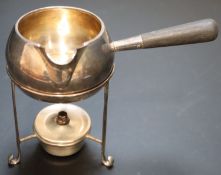 An Edwardian silver brandy warmer and stand with burner, Hukin & Heath, London, 1902/3, height 11.