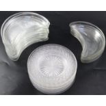 A set of twelve cut glass crescent shaped hors d'oeuvres dishes, with fan cutting to the base, 22cm,