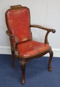 A set of four George I style walnut armchairs, first quarter 20th century, the scrolled top rails