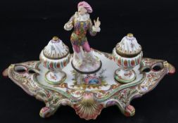 A late 19th / early 20th century Vienna porcelain inkstand, modelled with a central figure of a