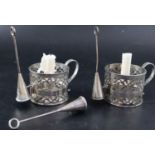 A pair of Victorian pierced silver cylindrical chambersticks E.T. London, 1875 with three