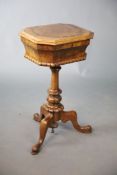 A Victorian walnut teapoy, with octagonal hinged top enclosing an interior with two canisters and