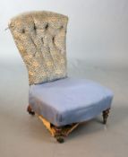 A Victorian Howard & Sons walnut buttoned back nursing chair, the back with original Howard & Sons