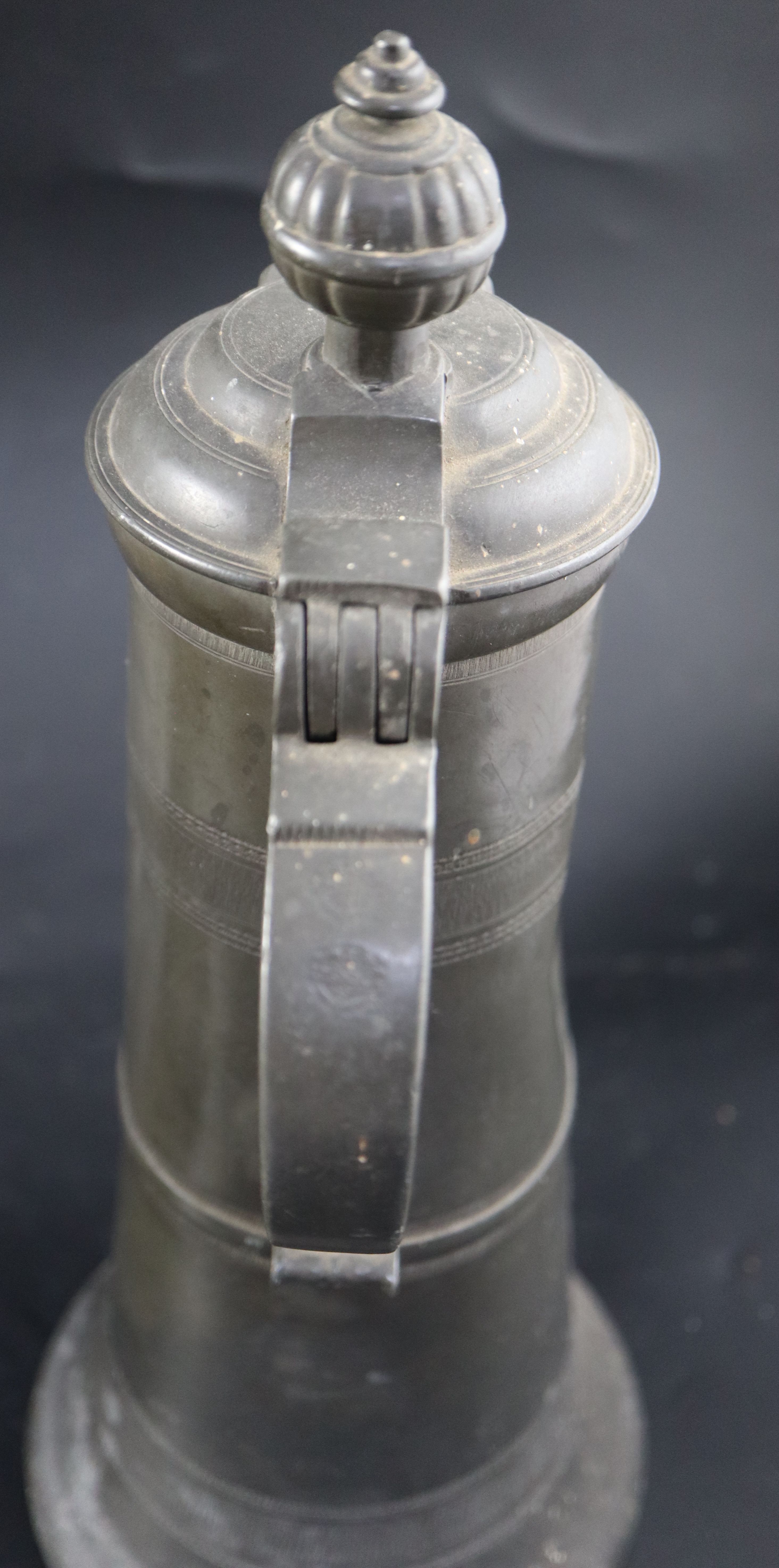 An 18th century Continental pewter flagon, initialled and dated 1777, height 35cm, a later flagon - Image 4 of 17