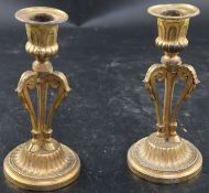 A pair of 19th century French ormolu candlesticks, with acanthus scroll and hoof stems, height