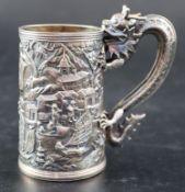 An early 20th century Chinese Export white metal christening mug by Wang Hing, with dragon handle
