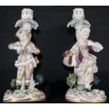 A pair of Victorian John Bevington bone china candlesticks, with child flower picker stems, pseudo