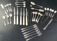 A collection of minor flatware, including a set of four Victorian silver beaded pattern condiment