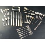 A collection of minor flatware, including a set of four Victorian silver beaded pattern condiment