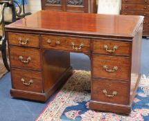 A George IV mahogany kneehole desk by William Williamson & Son of Guildford, second quarter 19th