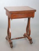 An early Victorian mahogany games / work table, with baize lined folding rectangular top, frieze