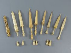 A collection of 19th century turned ivory and bone needle cases incorporating Stanhopes and other