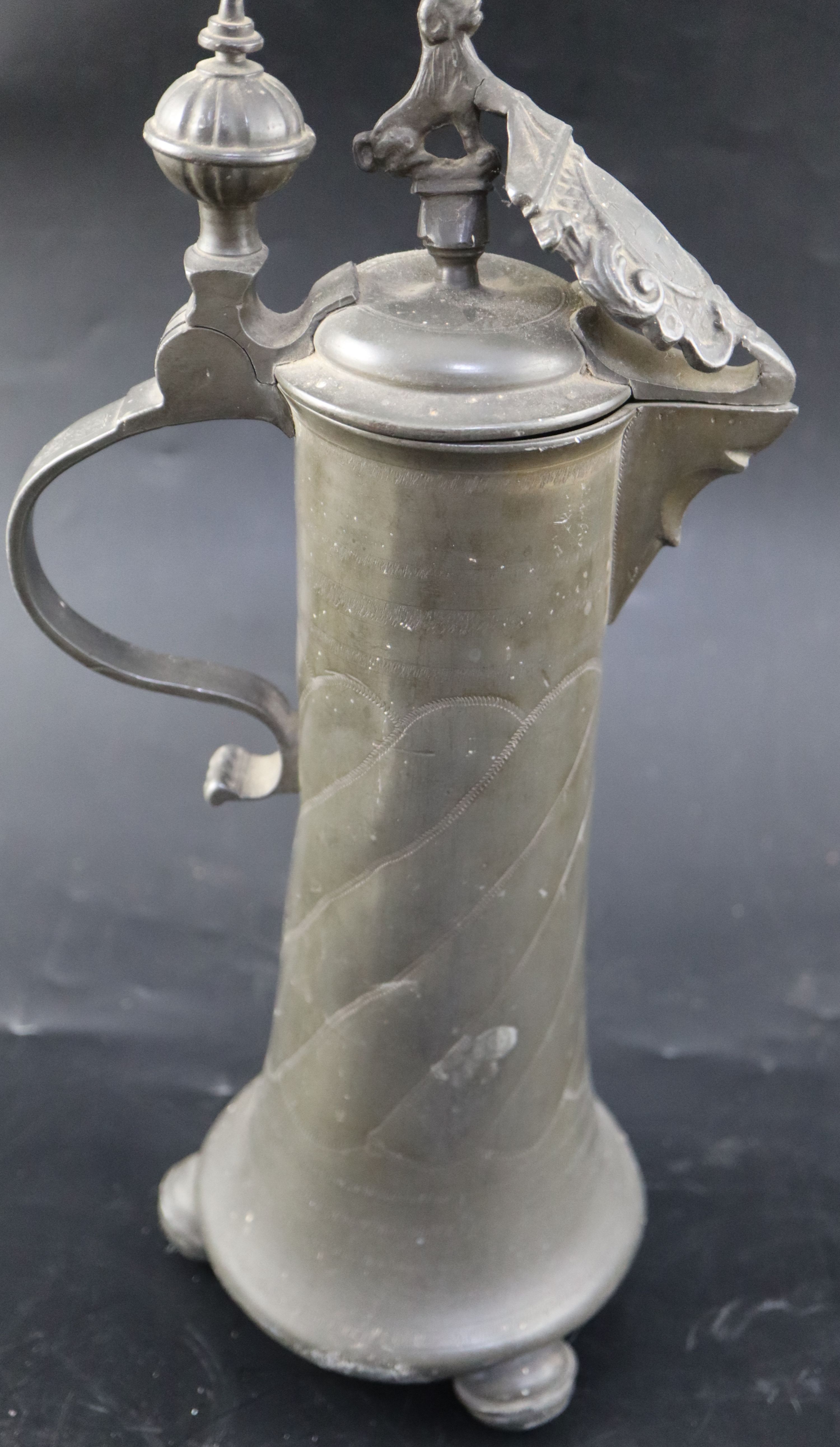 An 18th century Continental pewter flagon, initialled and dated 1777, height 35cm, a later flagon - Image 13 of 17