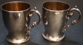 A pair of Victorian silver christening mugs, James Charles Edington, London, 1848, height 87mm,