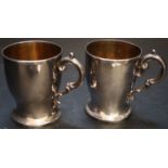 A pair of Victorian silver christening mugs, James Charles Edington, London, 1848, height 87mm,