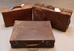 A group of three tan leather suitcases, one inscribed 'Brabourne', another 'Marchioness of Sligo'