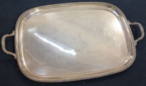 A George V silver two handled tea tray, by George Howson, Sheffield 1918, with engraved crests,