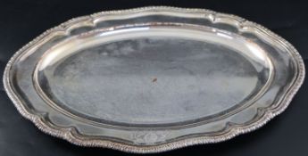 A George III Old Sheffield plate oval meat dish, with engraved crest and gadrooned border, 42.