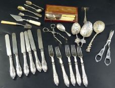 A collection of mixed silver flatware, including a 19th century cheese scoop, sifter spoon, grape