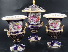 An English porcelain garniture of three vases, c.1830, each of two handled campana form, the central