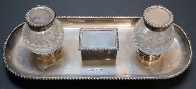 A late Victorian silver ovoid inkstand, with two cut glass wells and central lidded compartment,