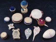 A collection of twelve assorted 19th century ivory pin cushions including teapot, stand with