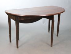 A George III mahogany supper table, the oval drop leaf top on square tapering legs, W.114.5cm D.