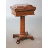 An early Victorian mahogany teapoy, with sarcophagus shaped rectangular top, fitted with three