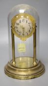 A brass electric mantel clock, under a glass dome, overall height 30cm