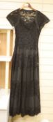 A 1950's black taffeta and lace evening dress