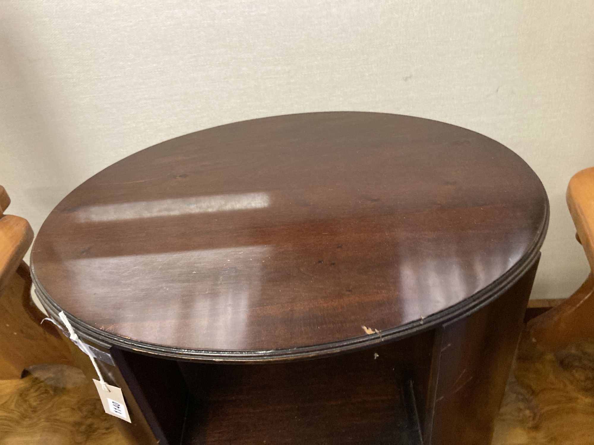 An oval mahogany three tier occasional table, width 64cm depth 50cm height 55cm - Image 2 of 4