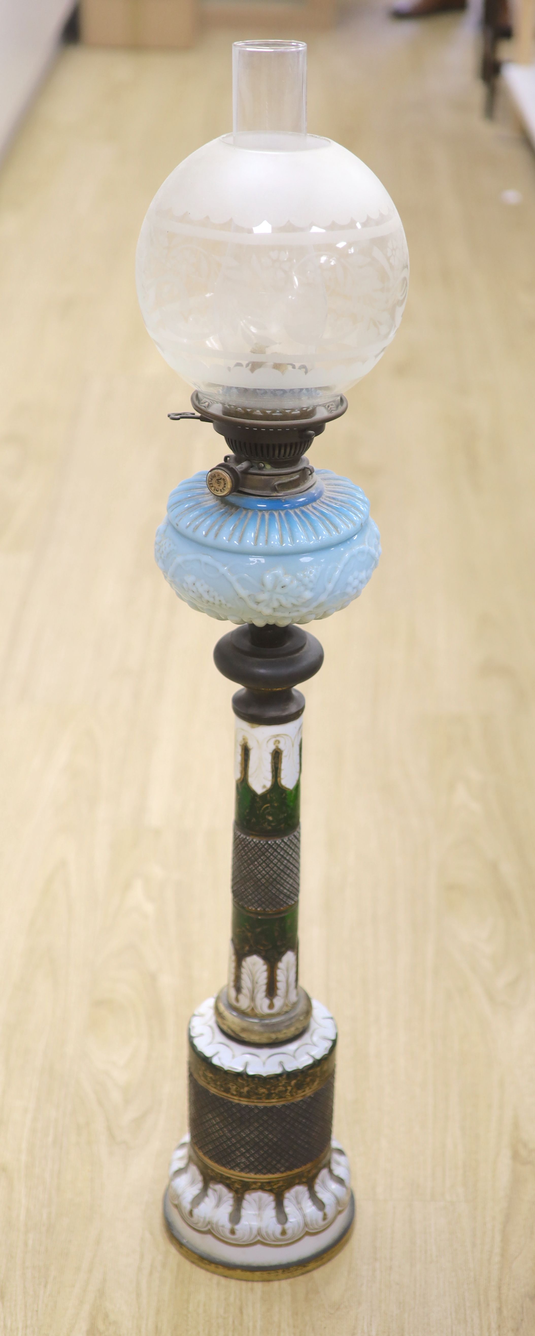 A 19th century Bohemian overlay glass oil lamp, height 99cm