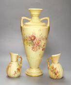 A Royal Worcester two-handled blush ivory vase, decorated with flowers, height 38cm, and a pair of