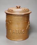 A French stoneware tobacco jar and cover, overall 26cm