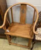 A Chinese elm armchair, with round back and pierced carved splat, width 67cm, depth 50cm, height