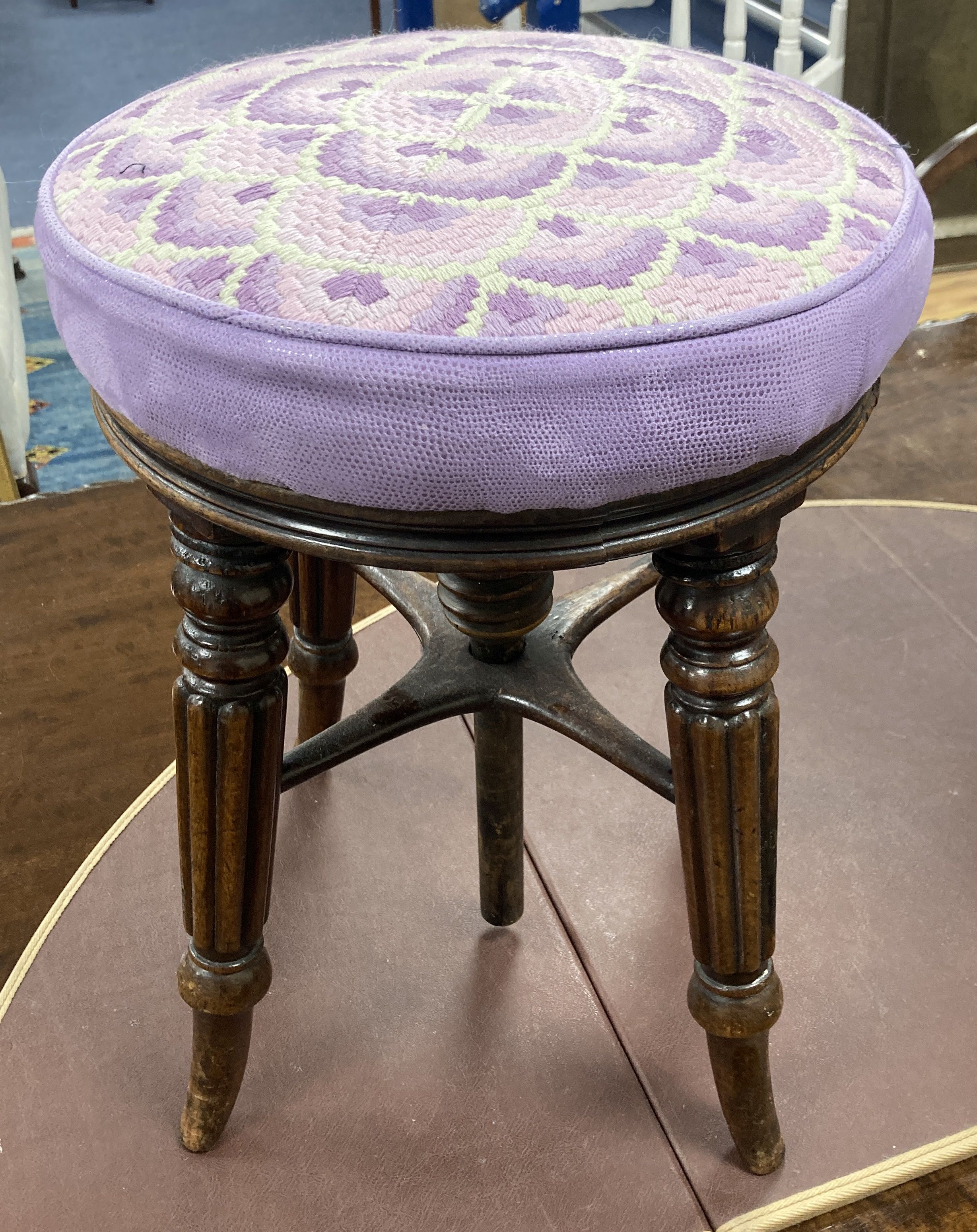 A Regency mahogany adjustable piano stool, 33cm diameter, height 45cm