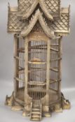 A carved wood birdcage, in Chinese style, height 80cm