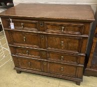 An oak and walnut chest, circa 1700, fitted two short drawers and three long drawers with mitred