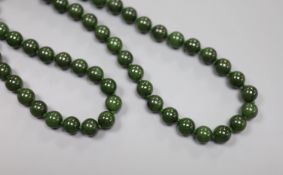 A single strand nephrite circular bead necklace, 82cm, gross weight 171 grams, one bead diameter