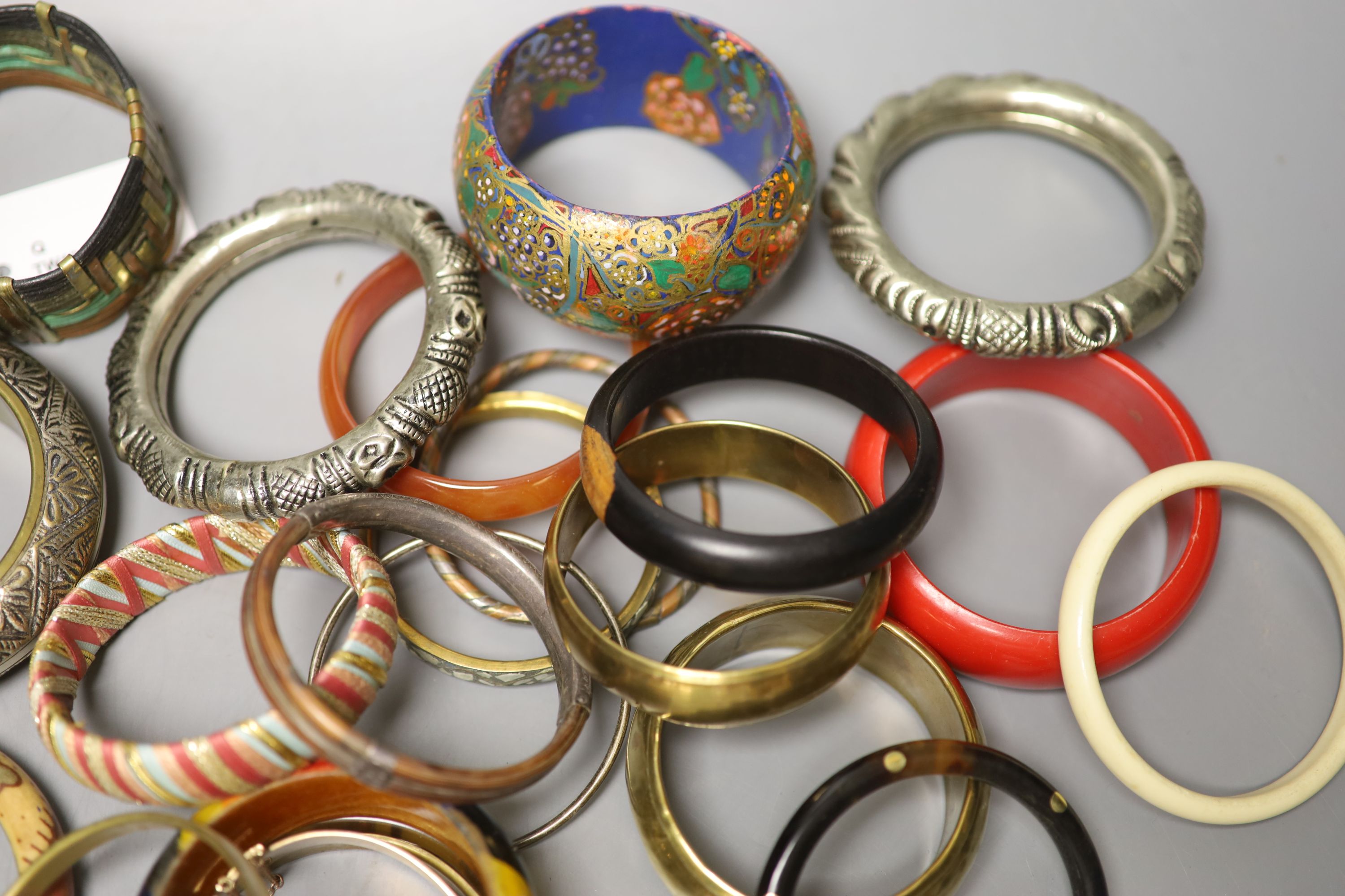 A collection of bangles, including five ethnic white metal examples, a faux tortoiseshell bangle - Image 4 of 5