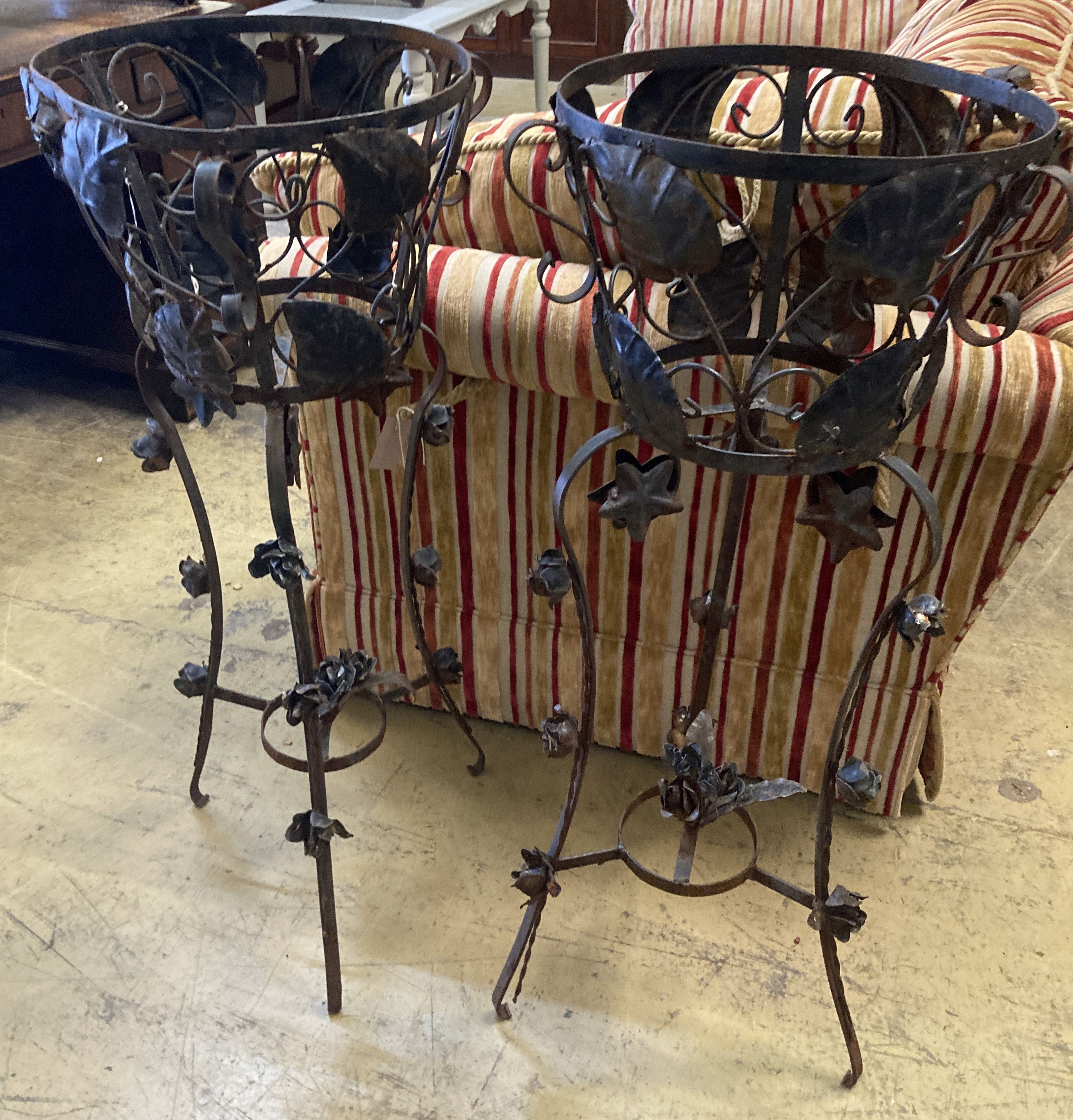 A pair of mid 20th century French wrought iron circular jardiniere stands, 42cm diameter, height