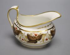 A Flight Barr and Barr cream jug painted with brown leaves and red flowers, height 11.5cm