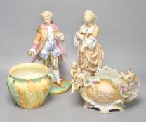 A Royal Worcester leaf-decorated vase, a Continental vase with amorini and a pair of figures of