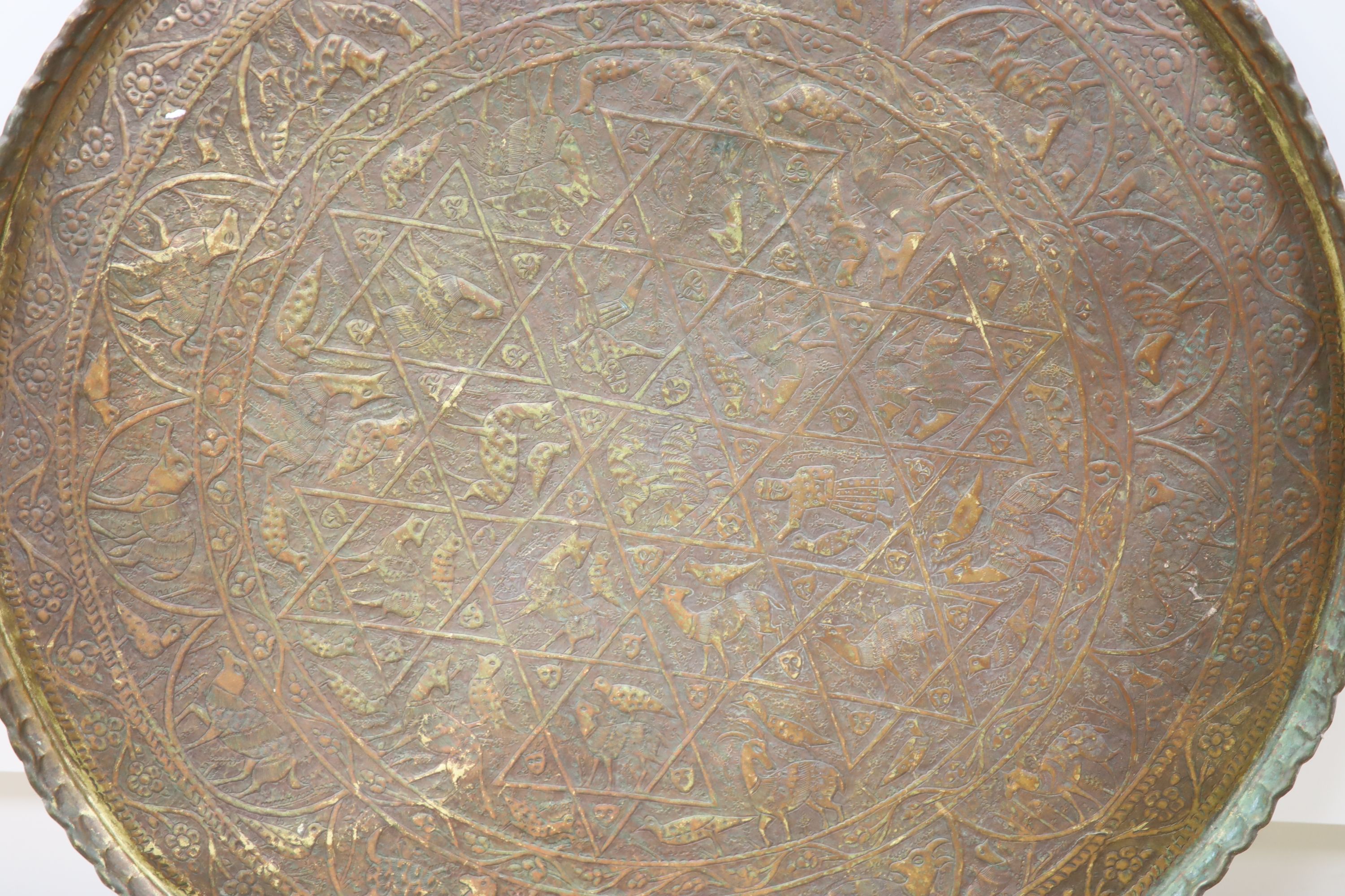 A large Persian engraved brass tray, 86cm diameter - Image 2 of 2