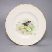 A Royal Worcester plate, painted with a blackbird on a blossoming branch by W. Powell, signed date